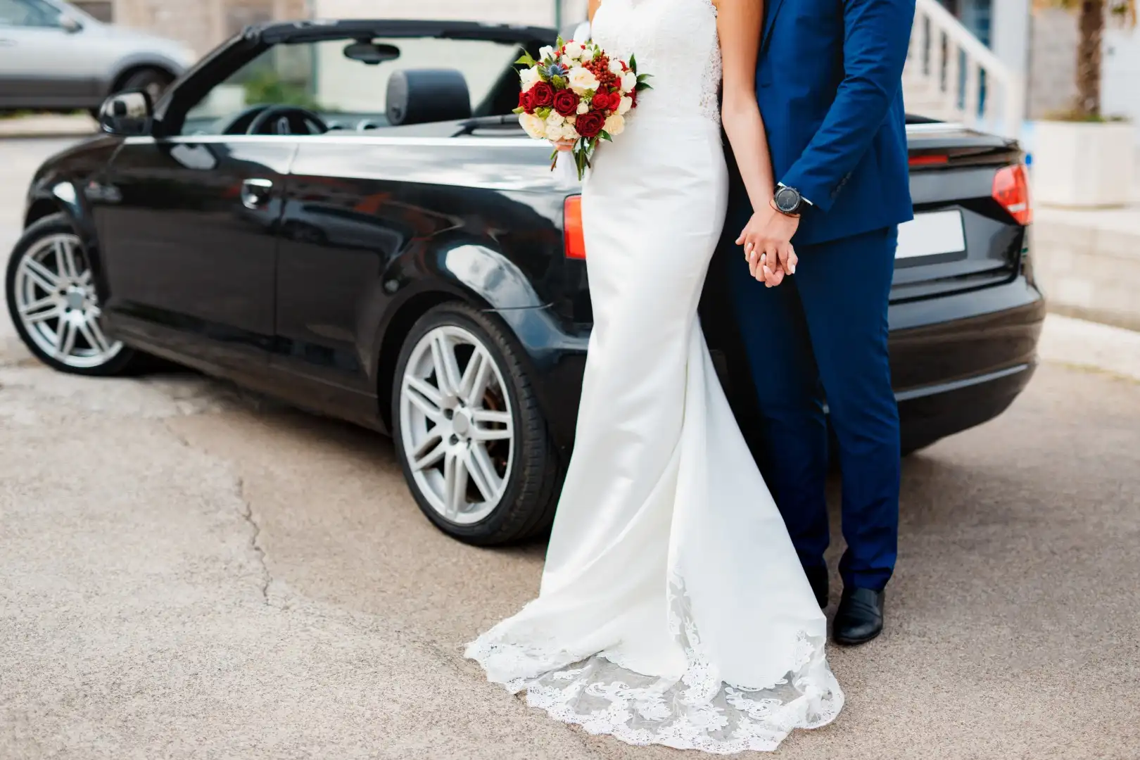 Wedding Transportation 1 groom holds the hand of bride with a bouquet of flowers