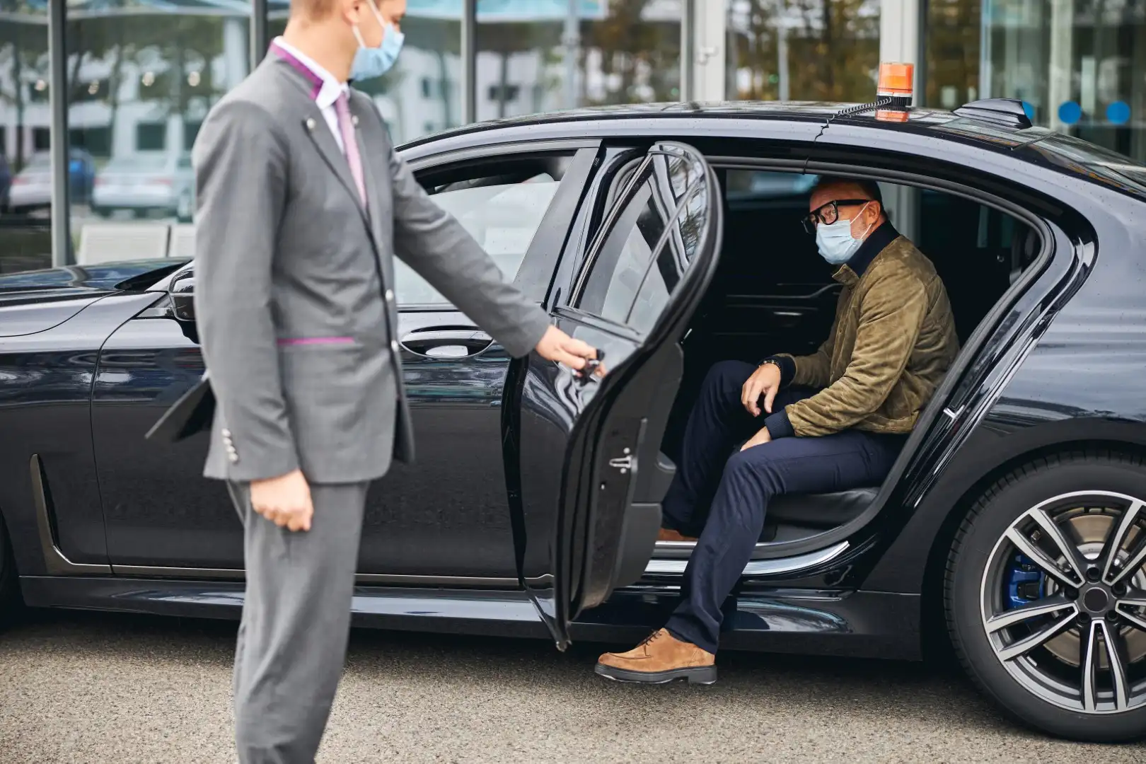 Bellevue 3 man in eyeglasses getting out of the elite taxi